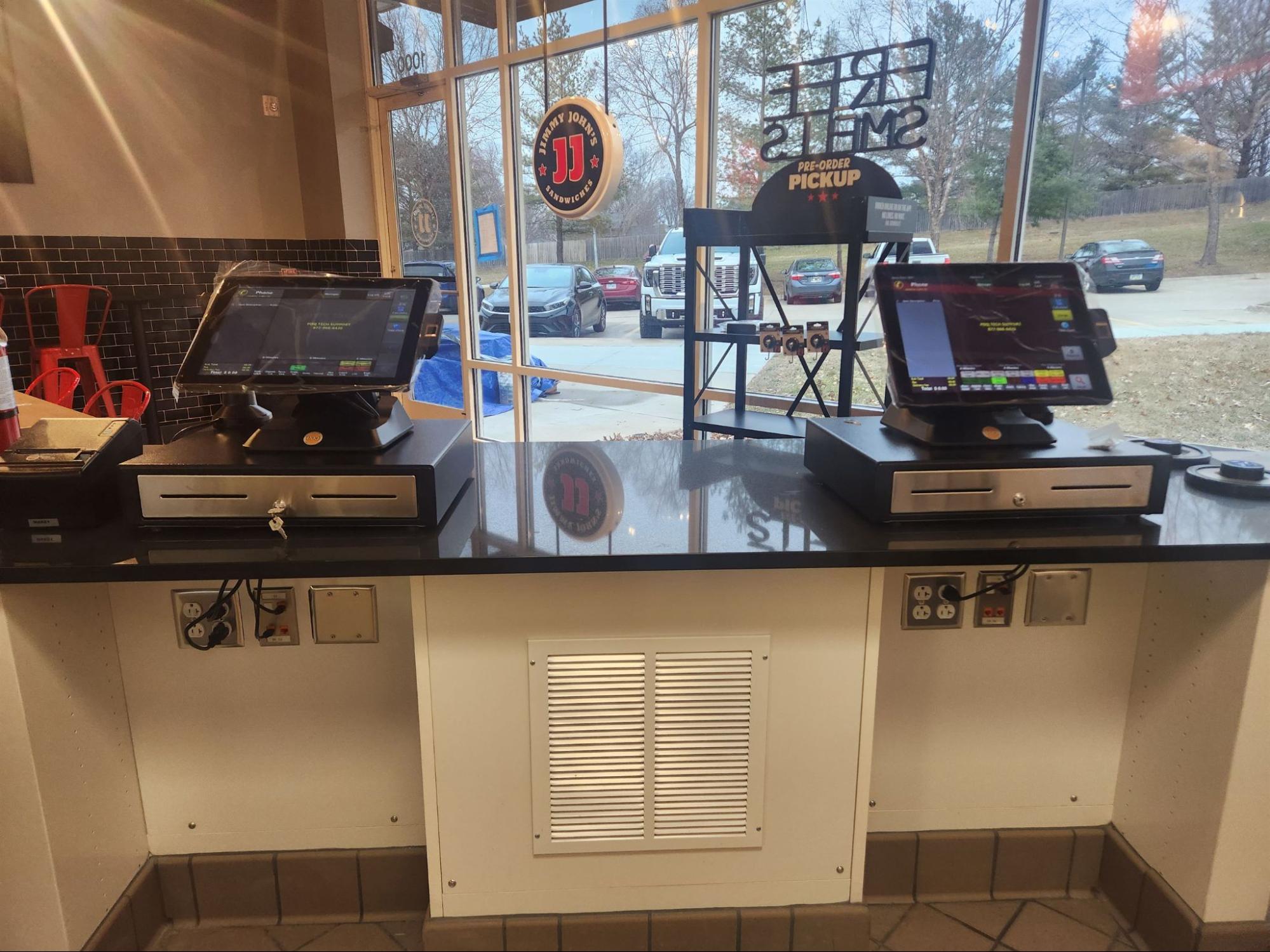 Jimmy John's Store counter with PDQ POS terminals.